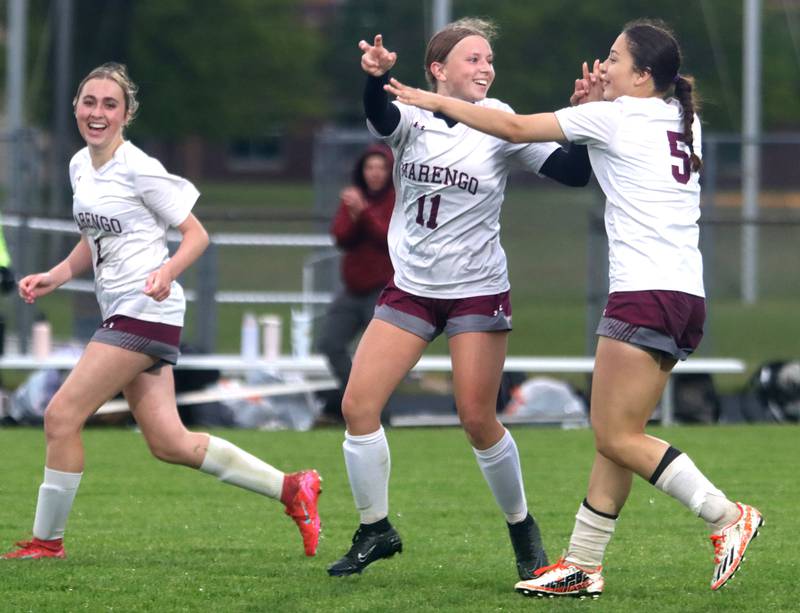 Marengo’s Kiley Brady, left, and Amy Pineda, right, celebrate a goal by Mackenzie Westwood, center, against Richmond-Burton in IHSA Class 1A Regional Title Game action soccer at Marengo High School in Marengo on Wednesday, May 21, 2025.