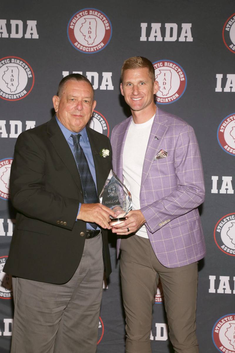 Former Johnsburg AD Jim Meyers receives his Illinois Athletic Directors Association Hall of Fame award on May 4, 2024.
