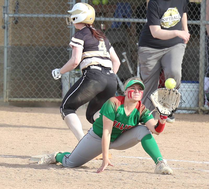 Sycamore's Tia Durst beats out an infield single as LaSalle-Peru's Ava Lannen stretches for the throw during their game Tuesday, April 11, 2023, at Sycamore High School.