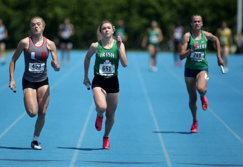 Seneca’s Lila Coleman (center) runs the anchor leg of the 1A 4x100-meter relay during the IHSA State Track and Field Finals at Eastern Illinois University in Charleston on Saturday, May 20, 2023.