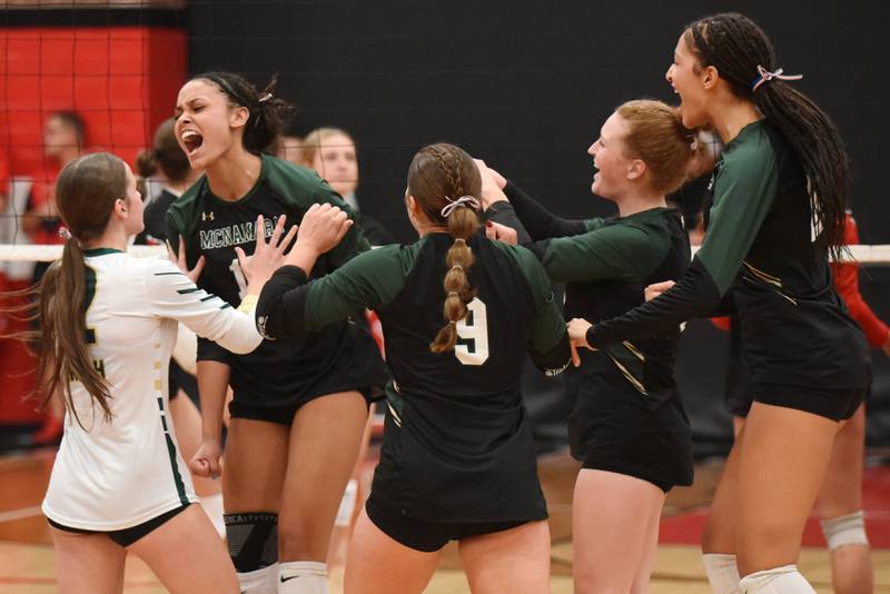 Bishop McNamara's Jersey Slone, second from left, is mobbed by her teammates after recording a kill during the Fightin' Irish's All-City game at Bradley-Bourbonnais Wednesday, Sept. 10, 2025.