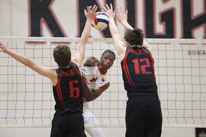 Bolingbrook’s Tristan Benbow powers a shot between the defense of Lincoln-Way Central on Tuesday May 7, 2024 in New Lenox.
