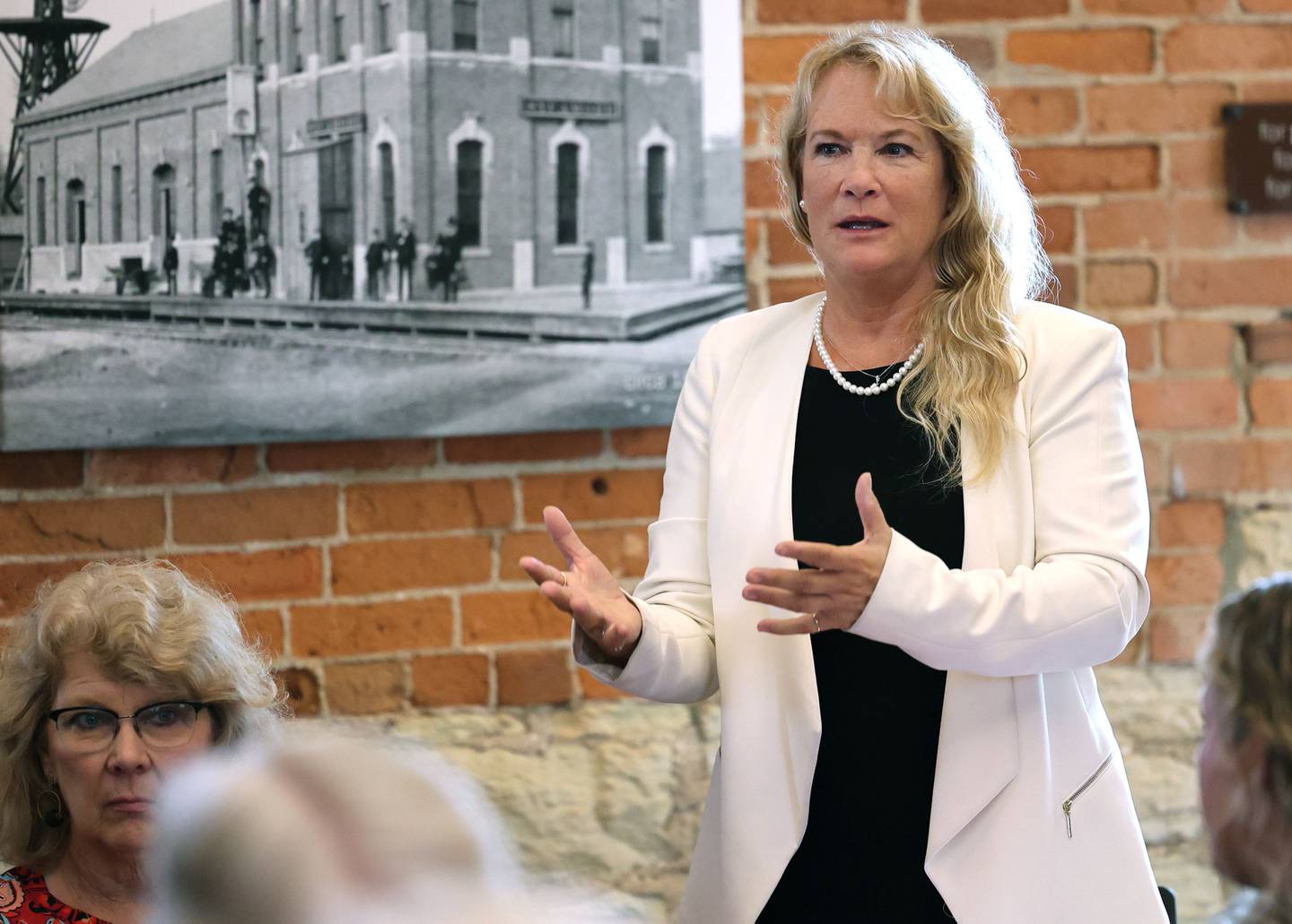 Sycamore Chamber of Commerce Executive Director RoseMarie Treml asks a question of the panel of law enforcement and judiciary members Wednesday, Sept. 13, 2023, during the Community Protection and Well-Being Forum: A Conversation about the Safe-T Act, in the DeKalb County Community Foundation Freight Room in Sycamore. The event was hosted by the Sycamore Chamber of Commerce.