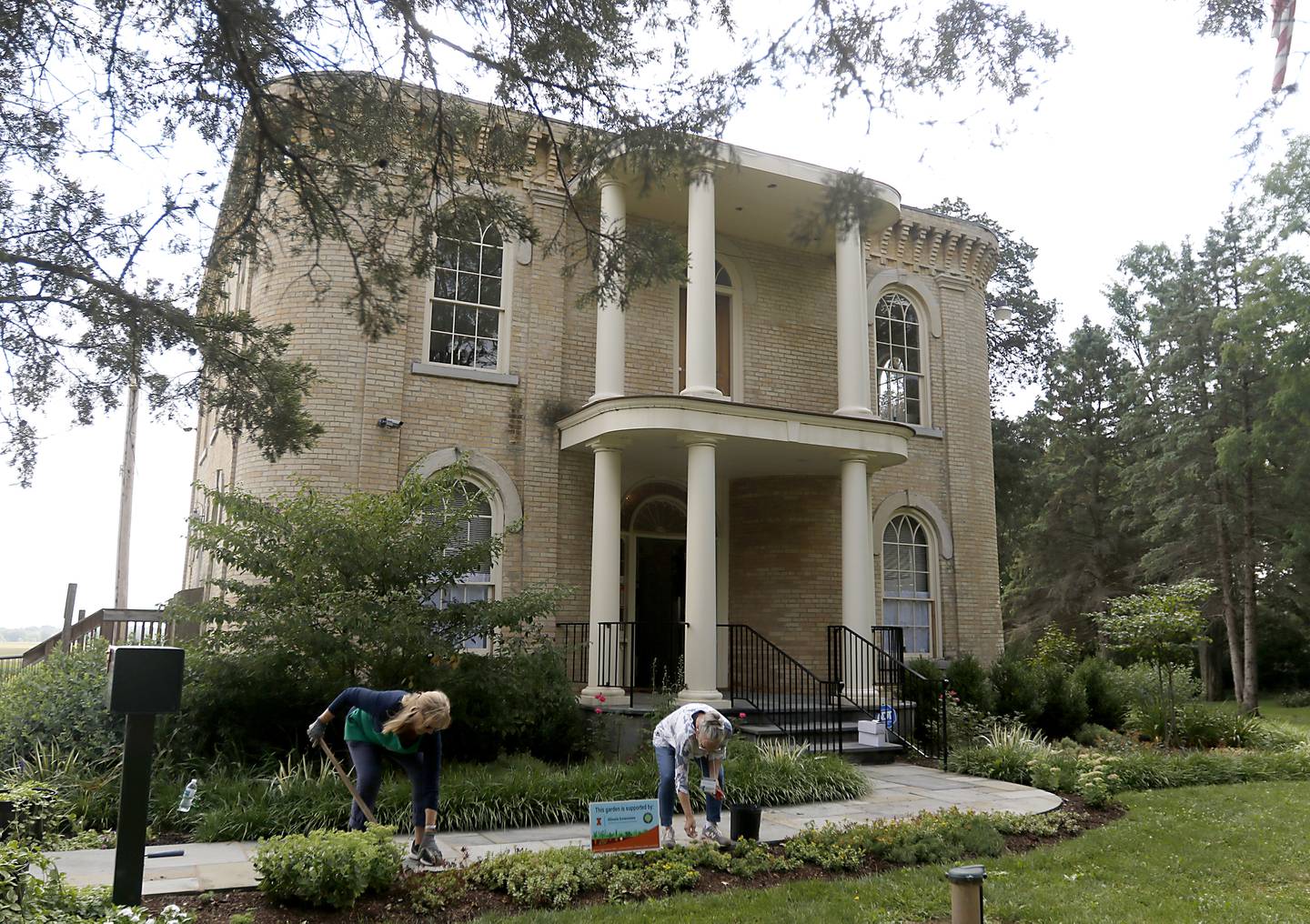 Illinois master gardeners Shelly Strapon and Shirlee Ambroziak tend to a garden on Thursday, Aug. 17, 2023, at the Stickney House in Bull Valley. The village is planning to make the Stickney House into an event venue and move the village offices to the barn.