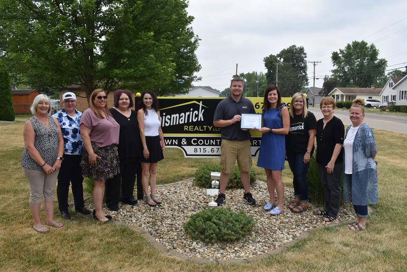 Karen Karpati, Streator Area Chamber ambassador; Katie Cox, chamber ambassador; Stacy Pochert-Rohr, Jennifer Gura, Dana Stuedemann, Patrick Chismarick, Angie Biros, Gigi Lansford, and Jennifer Bliss, of Chismarick Realty; and Courtney Levy, chamber director pose for a photo after Chismarick Realty was named the chamber's business of the month.