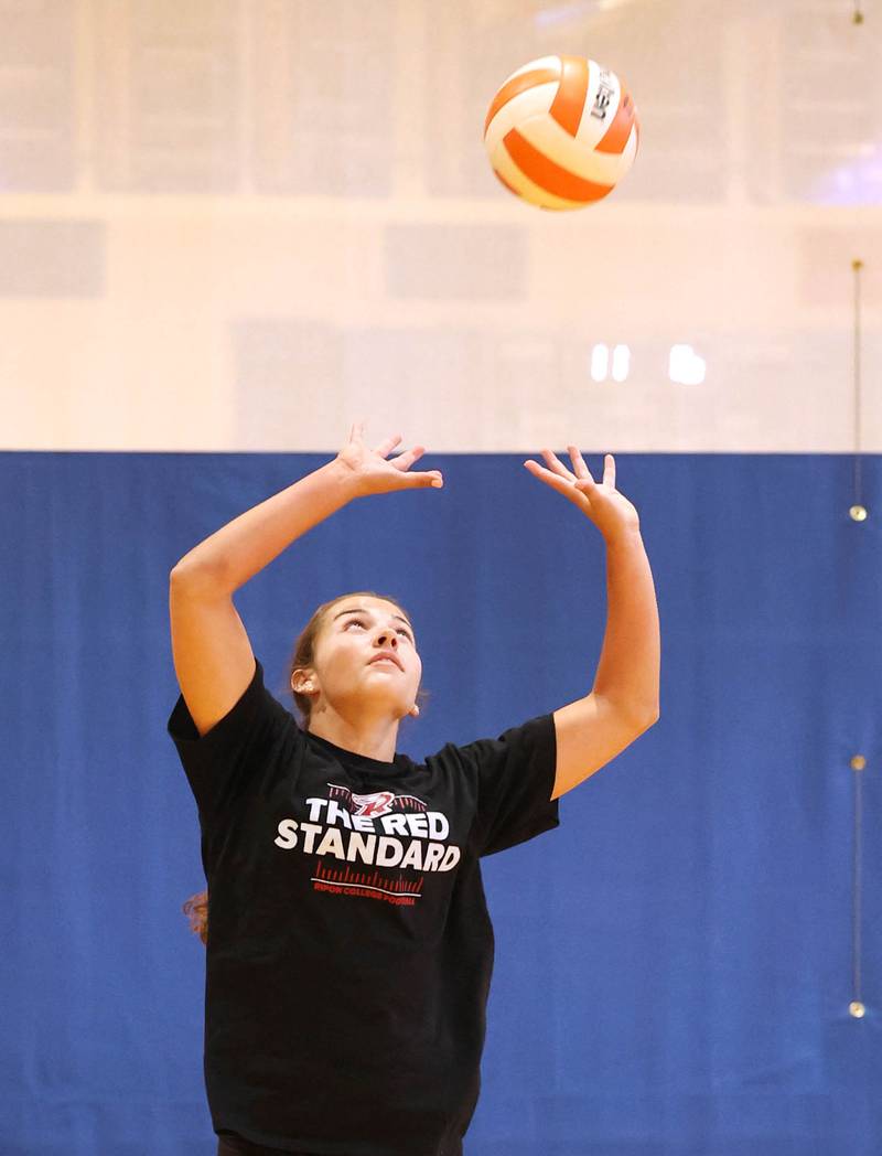 Genoa-Kingston’s Alivia Keegan sets during practice Thursday, Aug. 10, 2023, at the school in Genoa.
