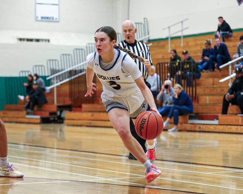 Oswego East's Maggie Lewandowski (3) drives baseline at the York Thanksgiving Tournament. Nov 13, 2023.