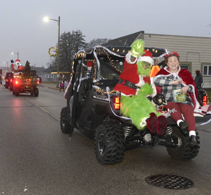 The Grinch waves to the crowd along Walnut Street in Oglesby on Saturday, Dec. 10, 2022, during the Winter Parade.