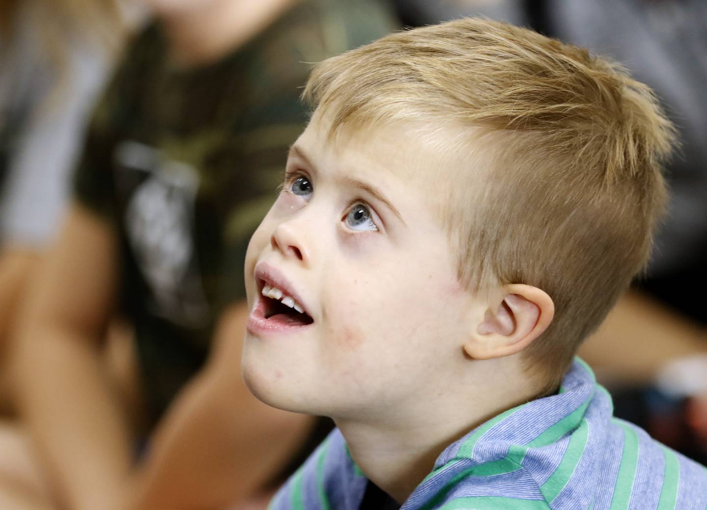 Cody Binger, a first grader with Down syndrome, listens as a book about community helpers is read Wednesday, Sept. 14, 2022, at Leggee Elementary School in Huntley. Binger will appear in a national video aimed at raising awareness of Down syndrome, set to be shown in Times Square on Saturday, Sept. 17. The video will include 500 adults and children with Down syndrome.