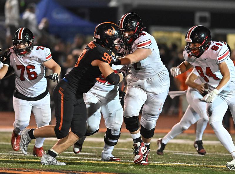 Lincoln-Way Central's Patrick Sammon (77) blocks Lincoln-Way West's Brayden Nelson (99) during the conference game on Friday, SEP. 19, 2025, at New Lenox.
