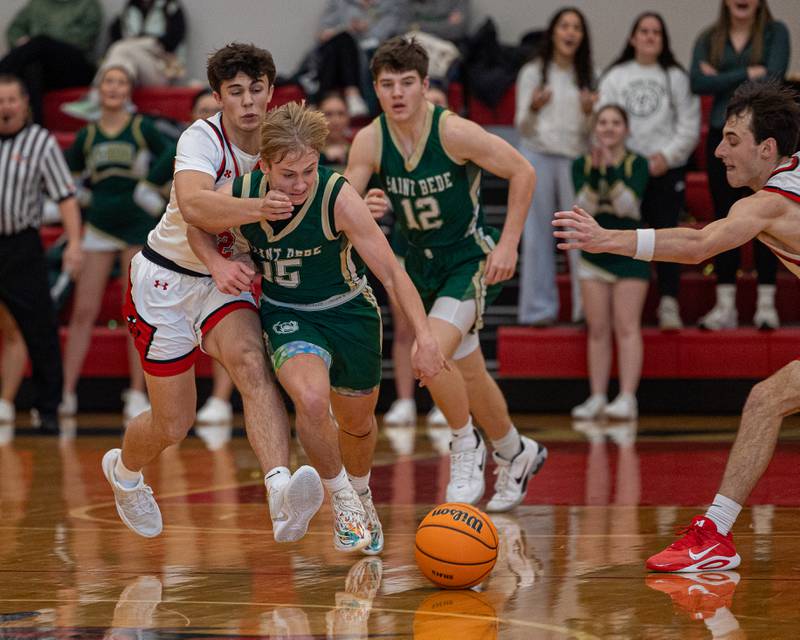 St. Bede's Geno Dinges (15) dribbles ball down court whilst being shoved by Geno Ferrari (2) of Hall on Saturday, January 31, 2026 at Hall High School in Spring Valley.
