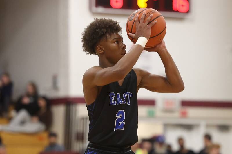 Lincoln-Way East’s BJ Powell puts up the deep shot against Lockport on Friday, Dec. 1, 2023 in Lockport.