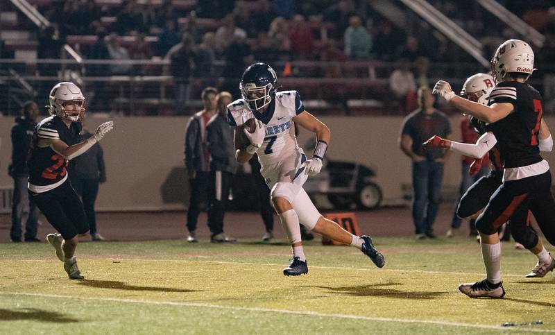 Nazareth Academy's Zach Hayes (7) runs after the catch for a touchdown against Benet Academy during a football game at Benedictine University in Lisle on Friday, Oct 21, 2022.
