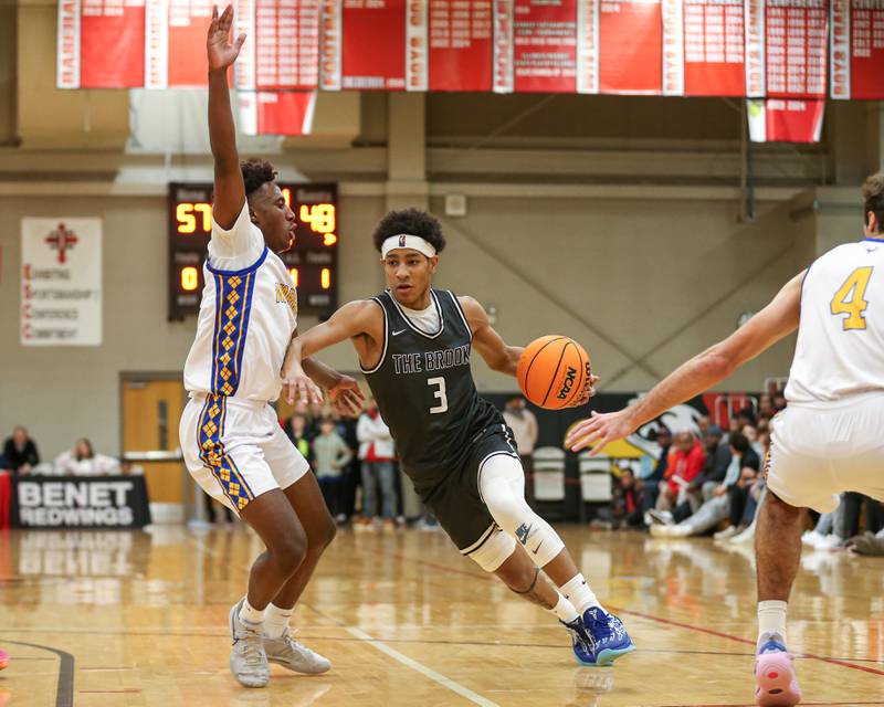 Bolingbrook's Davion Thompson (3) splits the defense during their When Sides Collide Shootout basketball matchup between Warren and Bolingbrook. Jan 25, 2025 in Lisle.