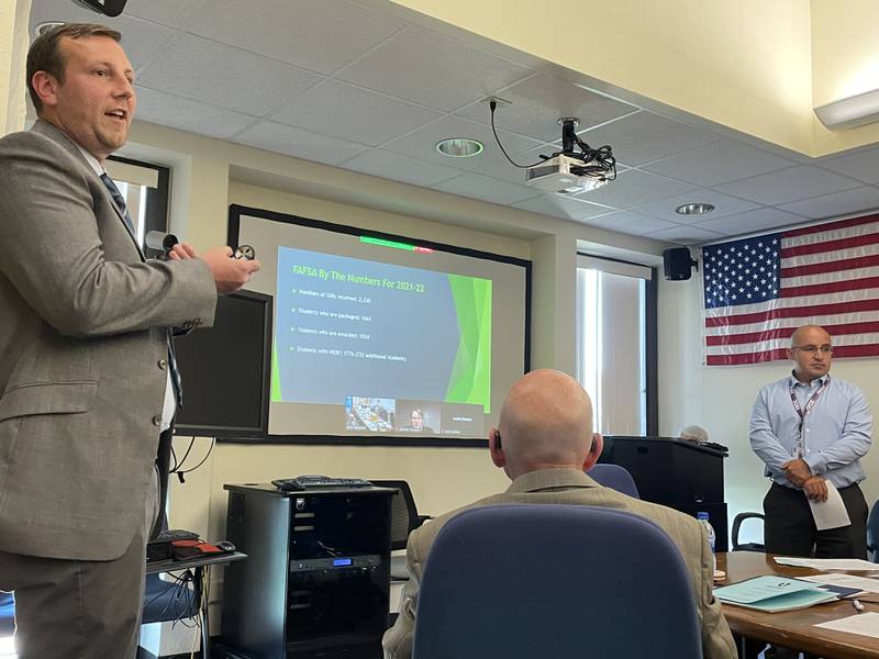Financial Aid Director Eric Johnson (left) and compliance specialist Miguel Hermosillo (far right)  presented an update to the Illinois Valley Community College board Thursday, June 9, 2022.