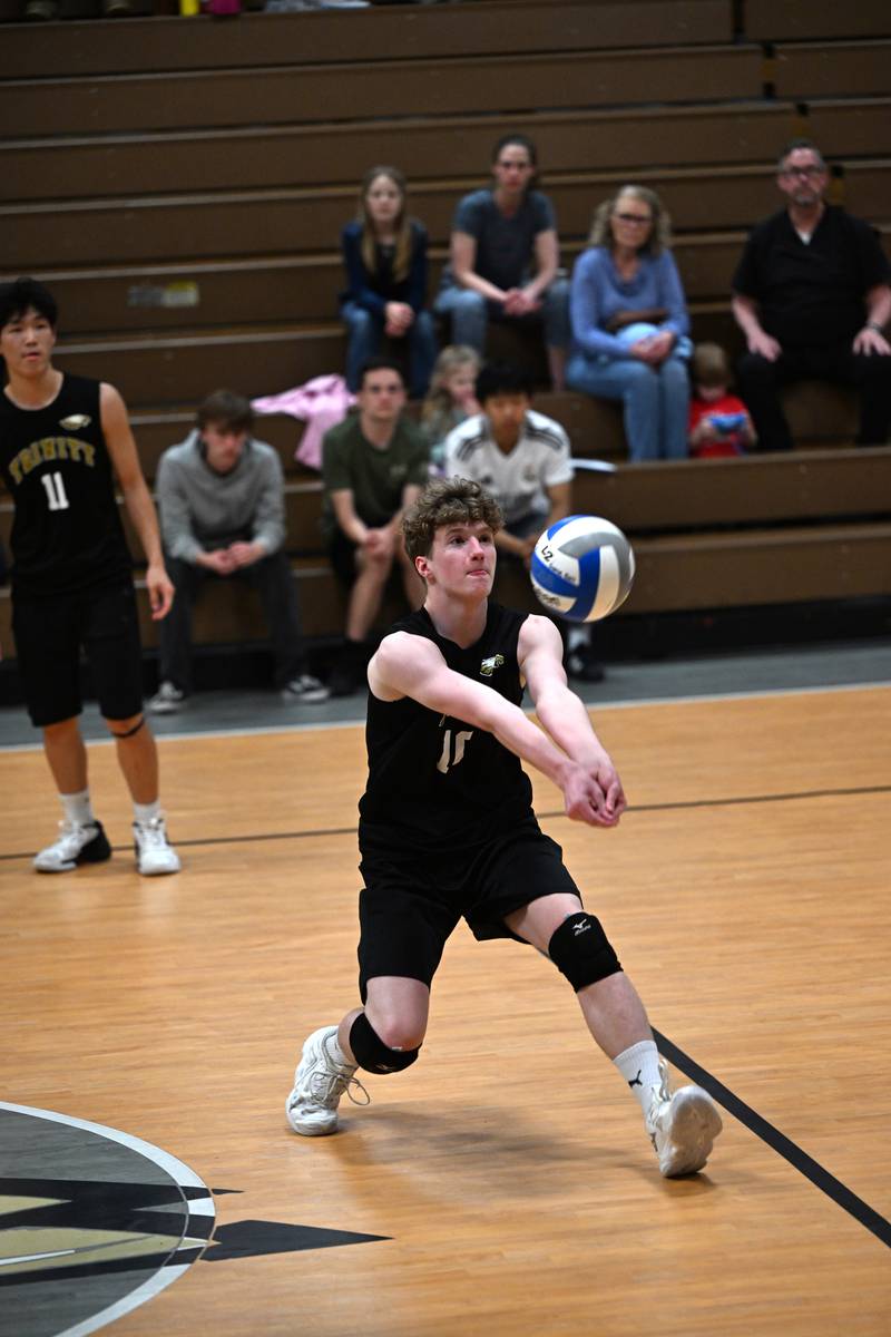 Kankakee Trinity Academy's  Josiah Davis assists during the match against Manteno on Thursday, May 1, 2025.