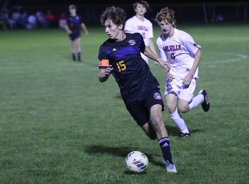 Somonauk's Luke Rader kicks the ball ahead of Earlville's Jeff Peterson in the Little Ten Conference championship game on Thursday, Oct. 5,  2023 at Hinckley High School.