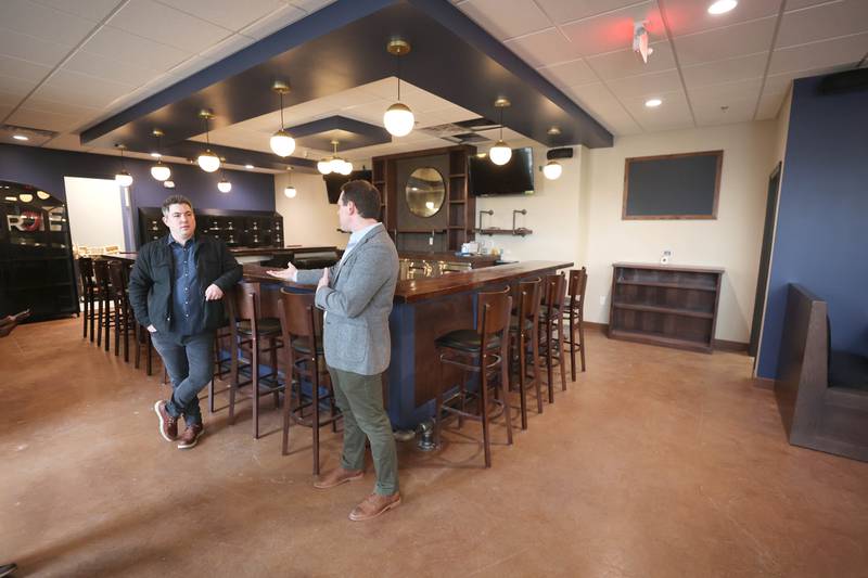 The Grove restaurant and bar owners Jason Engstrom (left) and Sam Patterson talk Thursday, March 23, 2023, at the new eatery in DeKalb. They plan to open their doors upon completion within the next few weeks.