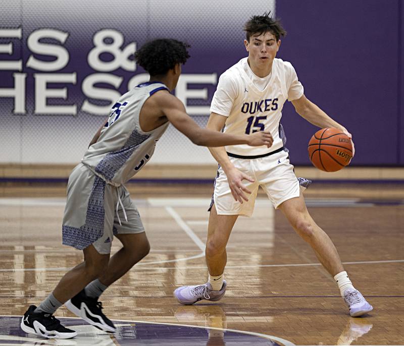Dixon’s Alex Harrison dribbles against Plano Wednesday, Dec. 6, 2023 at Dixon High School.