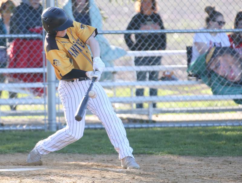 Putnam County's Drew Carlson smacks a hit against Woodland/Flanagan-Cornell on Tuesday, April 9, 2024 at Woodland High School.