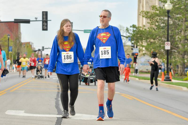 Sue and Craig Warner of Wheaton participate in the 2023 Super Hero 5k Fun Run in Wheaton.  Craig participated in the 2022 run in a wheelchair due to a stoke but now is participating on his own two feet on Saturday, April 15, 2023.