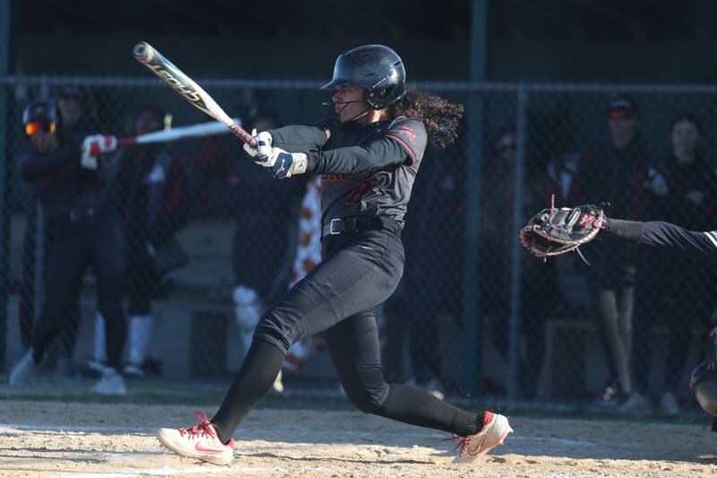 Bolingbrook’s Kaleigh Cawthon drives in a run against Plainfield Central on Wednesday, March 20, 2024.