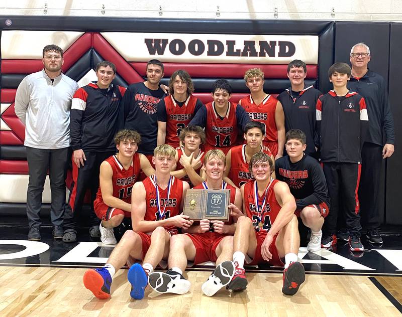 The Earlville Red Raiders assemble with their newly won Route 17 Thanksgiving Classic championship plaque at Woodland School on Saturday, Nov. 25, 2023, in rural Streator.