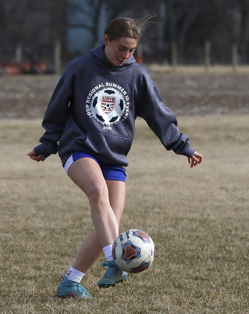 Johnsburg Aliyah Andersen takes a shot on goal during soccer practice Wednesday, March 8, 2023, at Johnsburg High School.