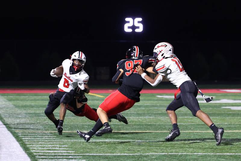 Bradley-Bourbonnais' Rontez Smith is forced out of bounds by Lincoln-Way Central's Dylan Wrobel during the Knight's 28-20 victory over Bradley-Bourbonnais on Friday, Oct. 3, 2025.