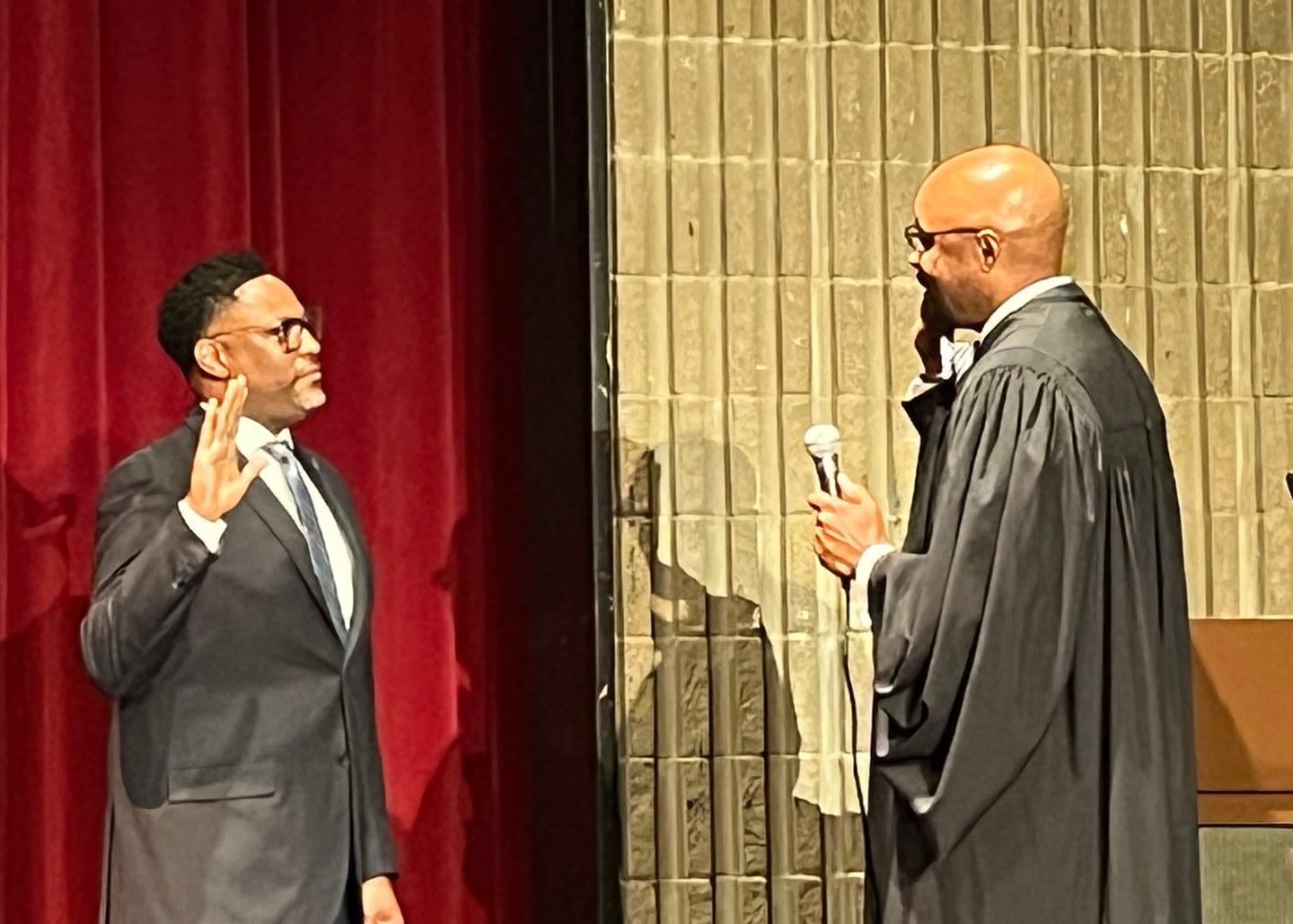 Antione Edwards (left) sworn into office as Joliet Township trustee by Will County Judge Vincent Cornelius on Tuesday, Oct. 10, 2023.