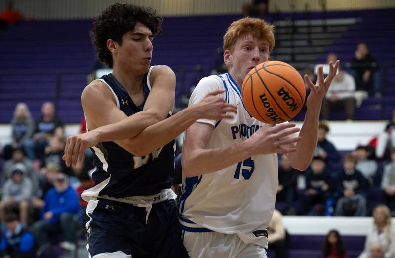Peotone's Ethan McNeill, right, tries to get a handle on the ball as IC Catholic's Jimmy Parilli, left, guards in the Thanksgiving tournament at Manteno High School on Monday, November 24, 2025.