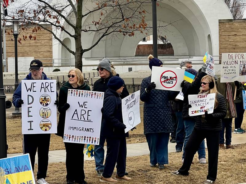A crowd gathers to protest President Donald Trump and his administration in Sterling, Illinois, on Friday, March 7, 2025.