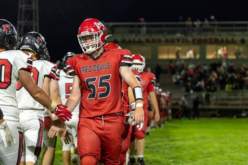 Jacob Mongan (55) of Hall leads team in postgame sportsmanship line on Friday, Sept 5, 2025 at Richard Nesti Stadium in Spring Valley.