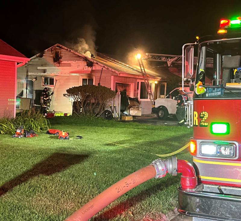 Firefighters responding to a house fire on Monday, Aug. 21, 2023, in the 300 block of Birkey Avenue in Crest Hill.