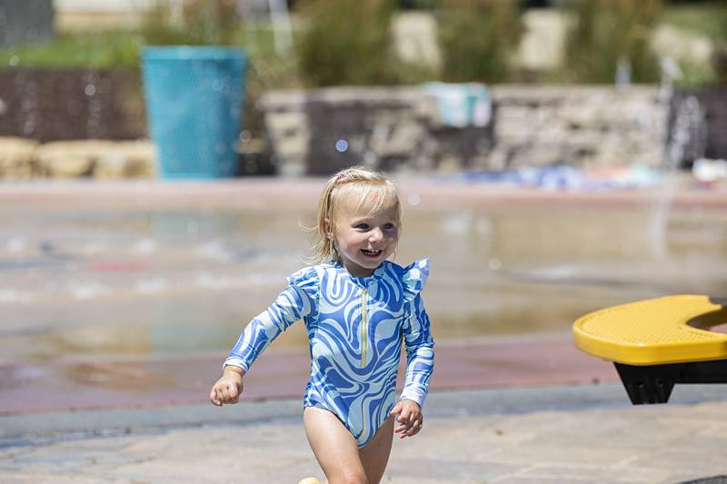 Baylor Schmidt, 2, of Tiskilwa cools off at the Dixon splash pad Thursday, July 27, 2023. Grandma and great-grandma took Baylor and her siblings to enjoy a day cooling off in the water.