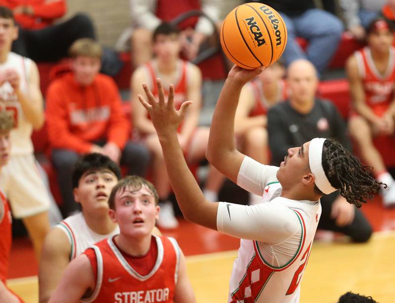 L-P's Marion Persich eyes the hoop as Streator's Nolan Lukach defends during the Dean Riley Shootin' The Rock Thanksgiving Tournament on Monday, Nov. 25, 2024 in Kingman Gym at Ottawa High School.