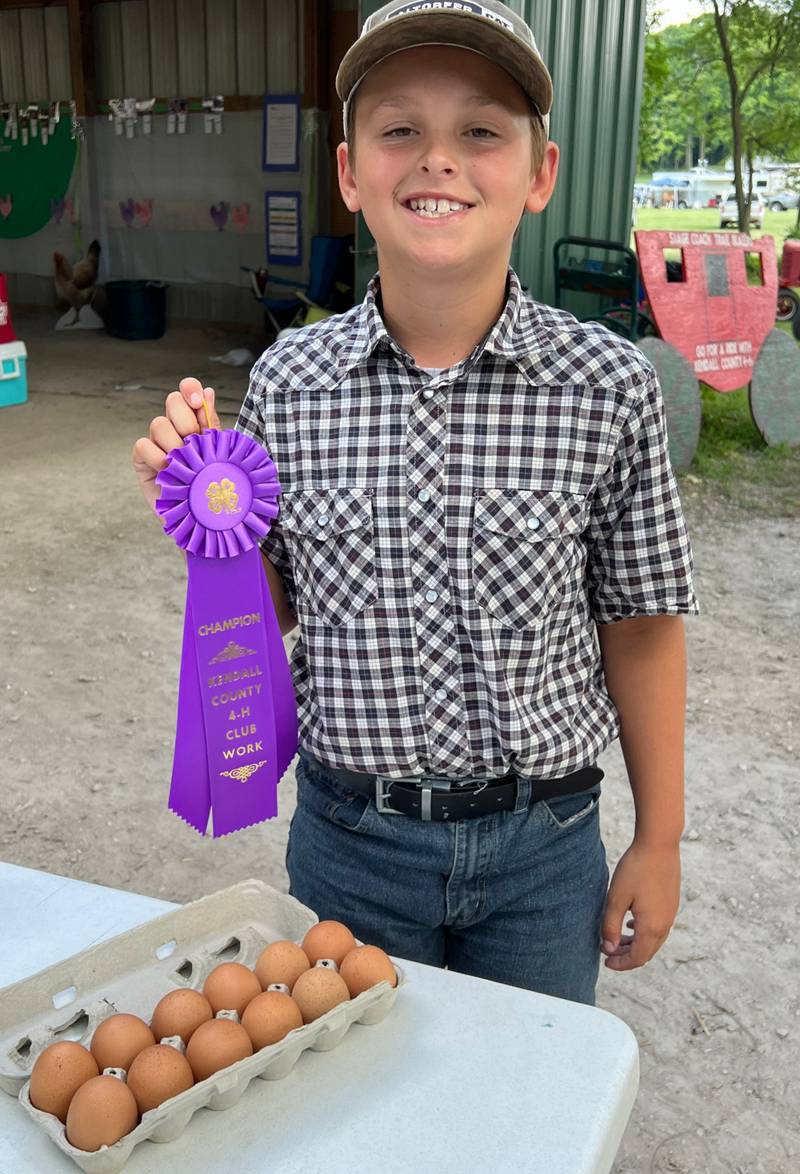John Schobert of Yorkville won the top prize for egg production at the Kendall County 4-H Shows last week.