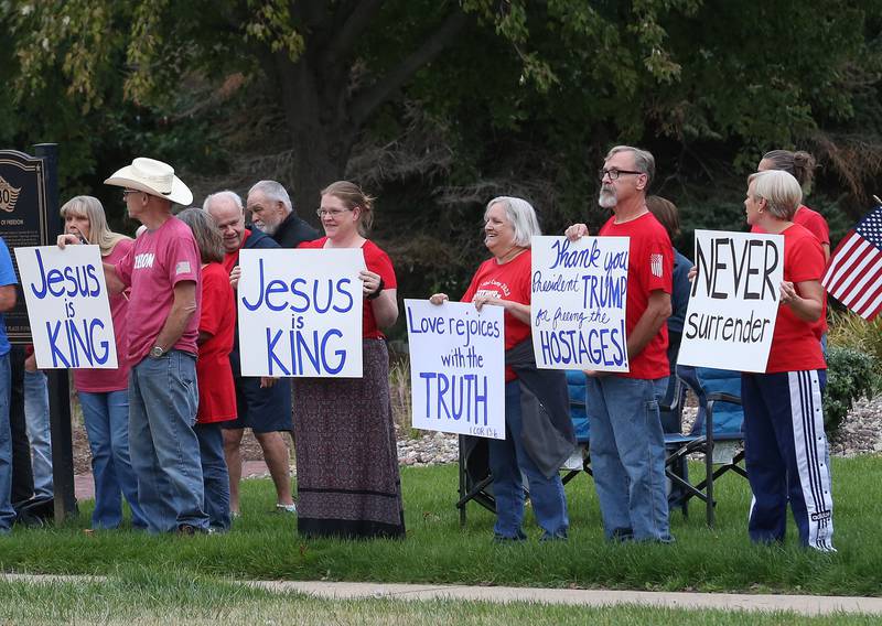 Supporters stand holding signs during A Night of Hope and Utity in honor of Charlie Kirk's birthday on Tuesday, Oct. 14, 2025 at City Hall Park in Princeton. The hour-long gathering paid tribute to Charlie along with standing up for peace, school shootings, violence and division.