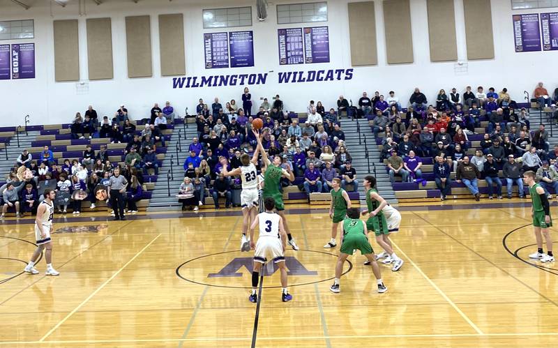 El Paso-Gridley's Jake Funk (23) and Seneca's Lane Provance (25) leap for the game-opening jumpball at the championship game of the Class 2A Wilmington Regional on Friday, Feb. 25, 2022.