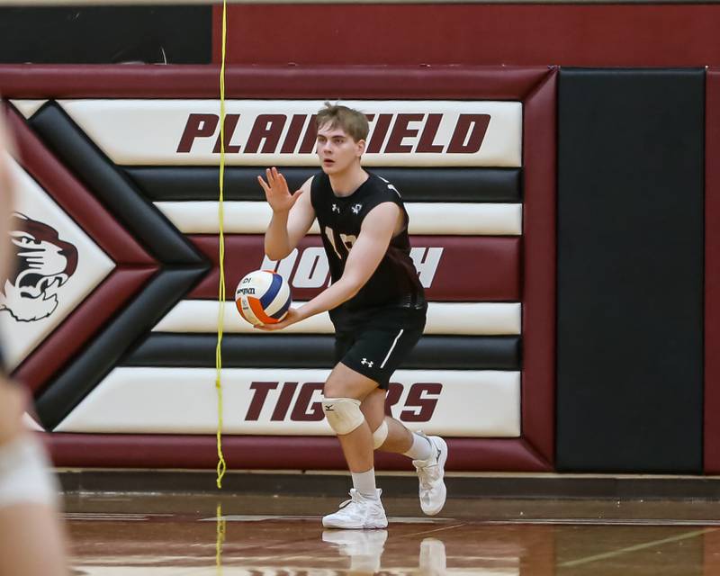 Plainfield North's Nathan Chlebek (18) serves during volleyball match between Neuqua Valley at Plainfield North.  April 29, 2024.