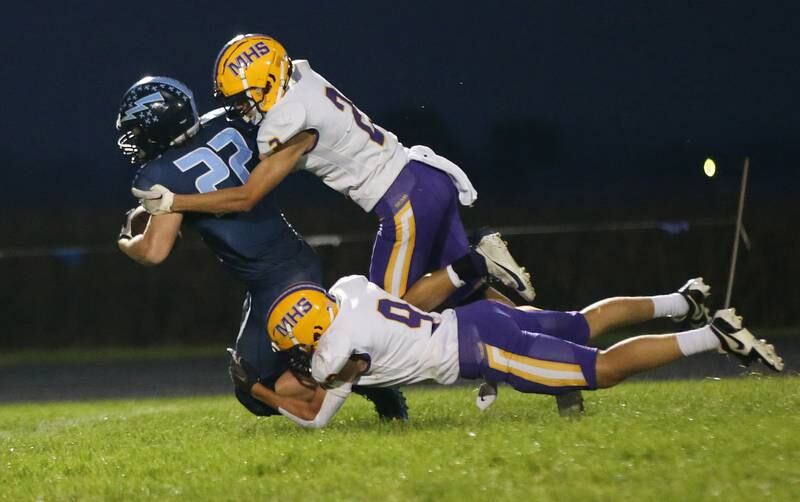 Bureau Valley's Elijah Endress carries the ball as Mendota's Keegan Beetz and Gavin Evans bring him down on Friday, Sept. 22, 2023 at Bureau Valley High School.