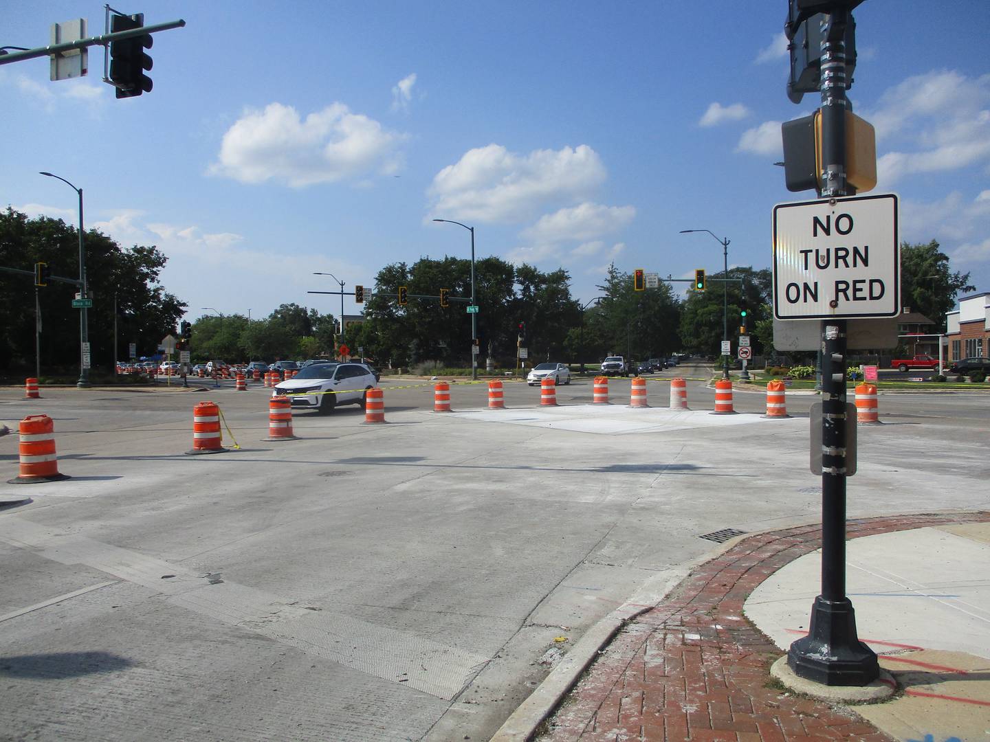 Construction barriers are set up around the Six Corners intersection in Joliet for an ongoing repaving project. Aug. 9, 2025