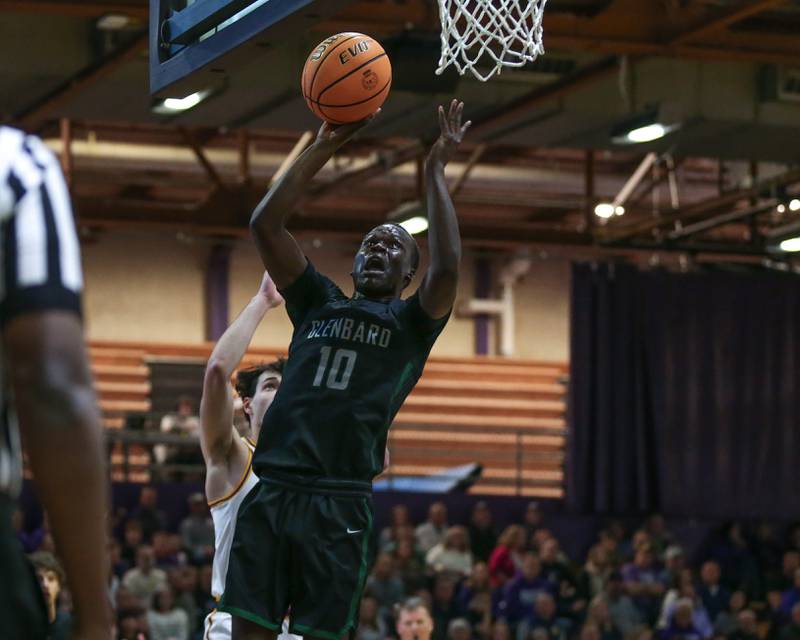 Glenbard West's Josh Abushanab (10) lays up a shot during their basketball game between Glenbard West at Downers Grove North. Jan 24, 2025 in Downers Grove.