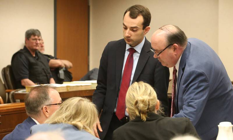 Lead prosecutor attorney Mark Shlifka and assistant Chris Koch meet with Chester Weger's attorney Andy Hale and assistant attorney Celeste Stack during a mini trial evidentiary hearing regarding the Chester Weger case on Wednesday, May 14, 2025  at the La Salle County Government Complex in Ottawa.