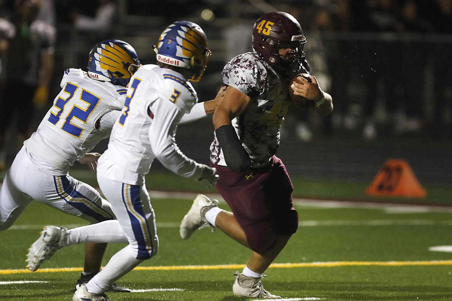 Richmond-Burton's Braxtin Nellessen, right runs for a touchdown as he is chased by Johnsburg's Colton Centnarowicz, left, and Maddux Malachuk, center, during a Kishwaukee River Conference football game Friday, Oct. 7, 2022, between Richmond-Burton and Johnsburg at Richmond-Burton Community High School in Richmond.
