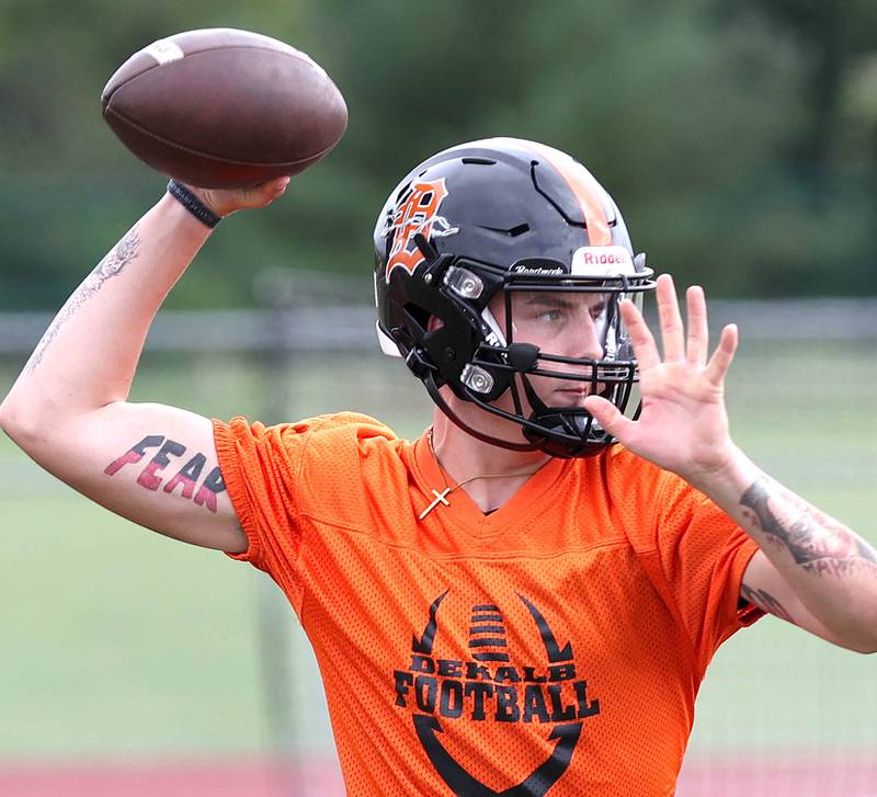 DeKalb quarterback Adrien McVicar throws a pass Monday, Aug. 8, 2022, at the school during their first practice ahead of the upcoming season.