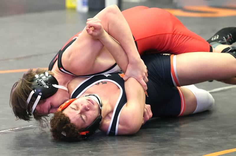 Naperville Central’s Henry Rydwelski works to pin DeKalb’s Adrian Franco in their 170 pound semifinal match Friday, Jan. 20, 2023, during the DuPage Valley Conference wrestling tournament at DeKalb High School.