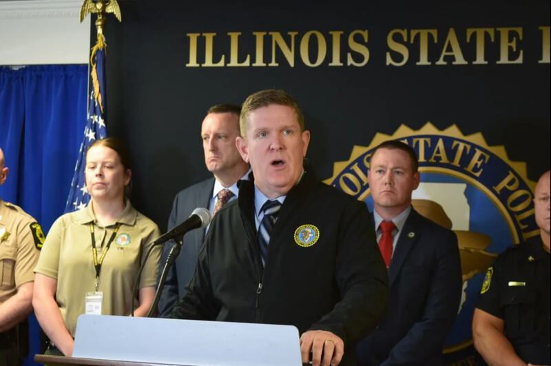 Illinois State Police Director Brendan Kelly, center, released toxicology results of the driver involved in a crash that killed four children at a central Illinois after-school program during a news conference Thursday in Springfield.