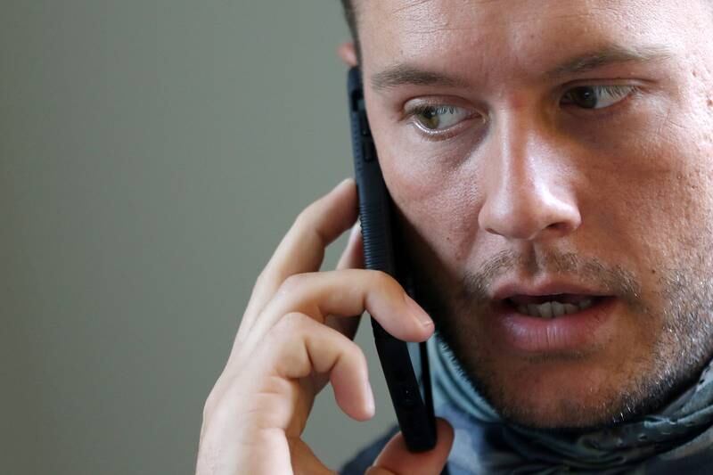 Northern Illinois Recovery Center partner Chris Reed takes a call in his office on Wednesday, March 10, 2021 in Crystal Lake.