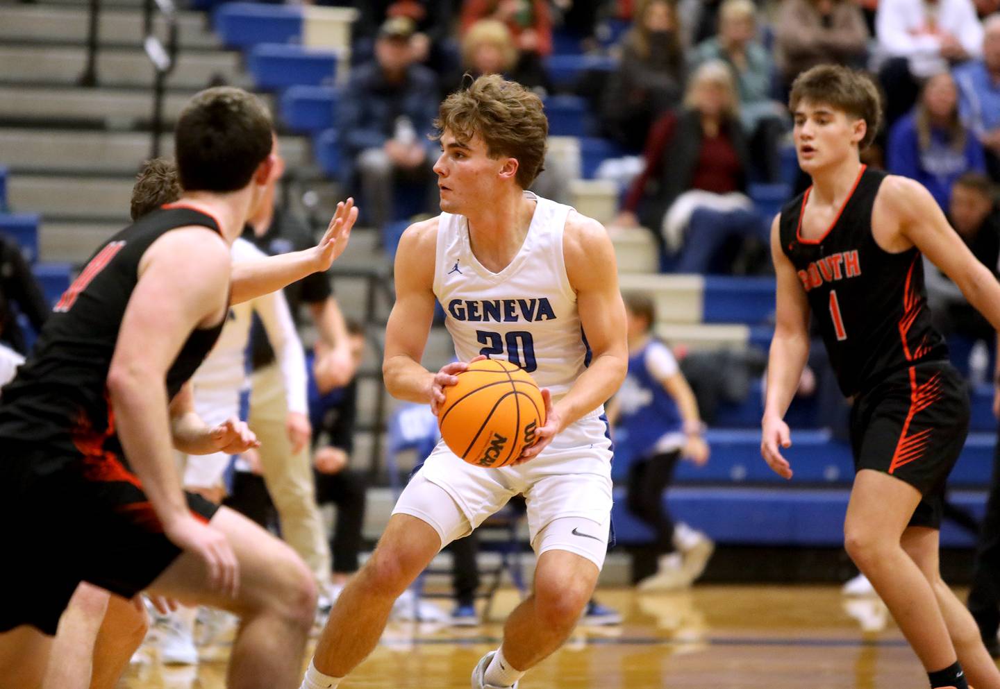 Geneva’s Jack Hatton looks for an opening during a game against Wheaton Warrenville South on Friday, Jan. 24, 2025 at Geneva.